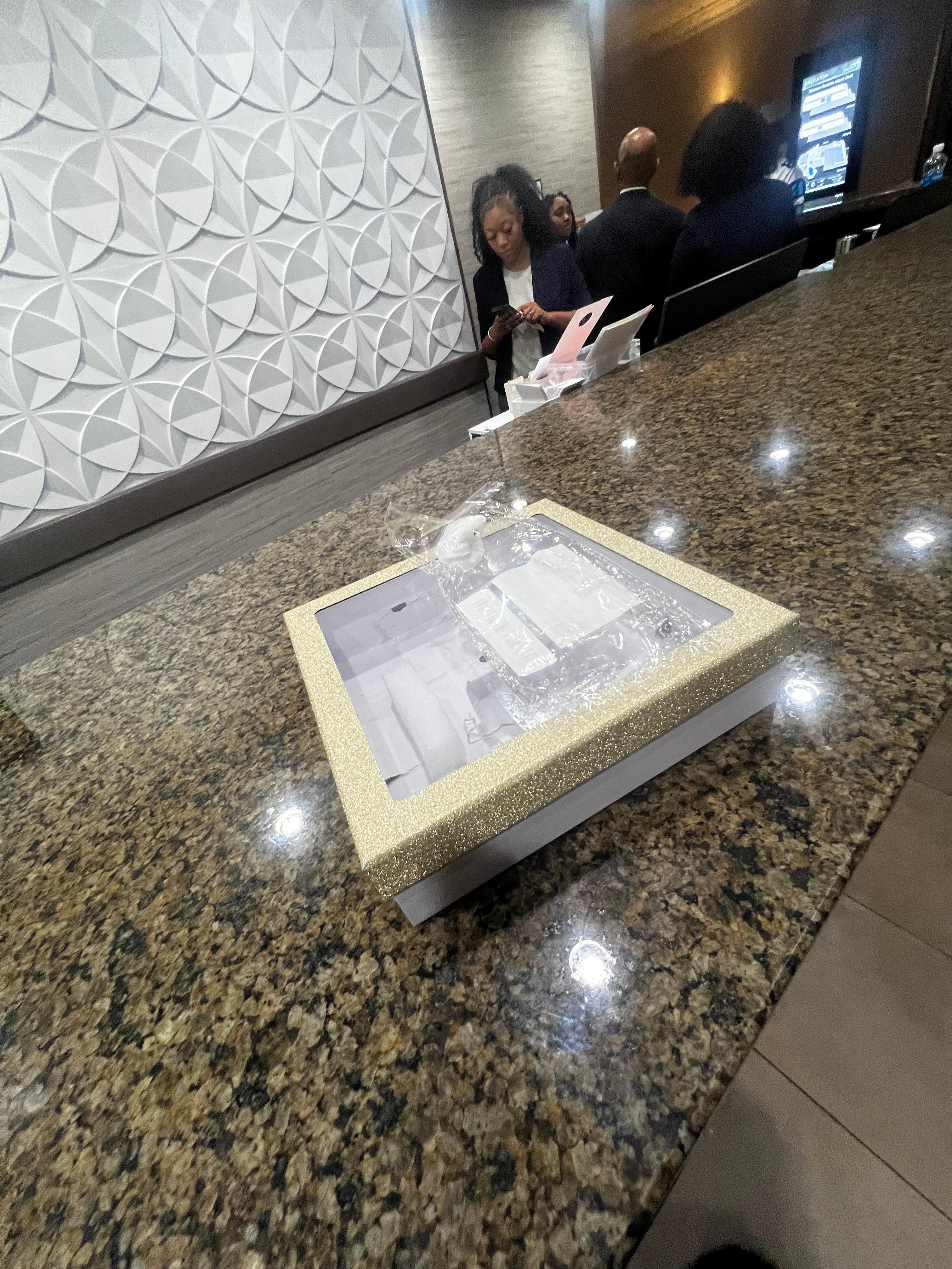 Me taking the roaches to the front desk. 