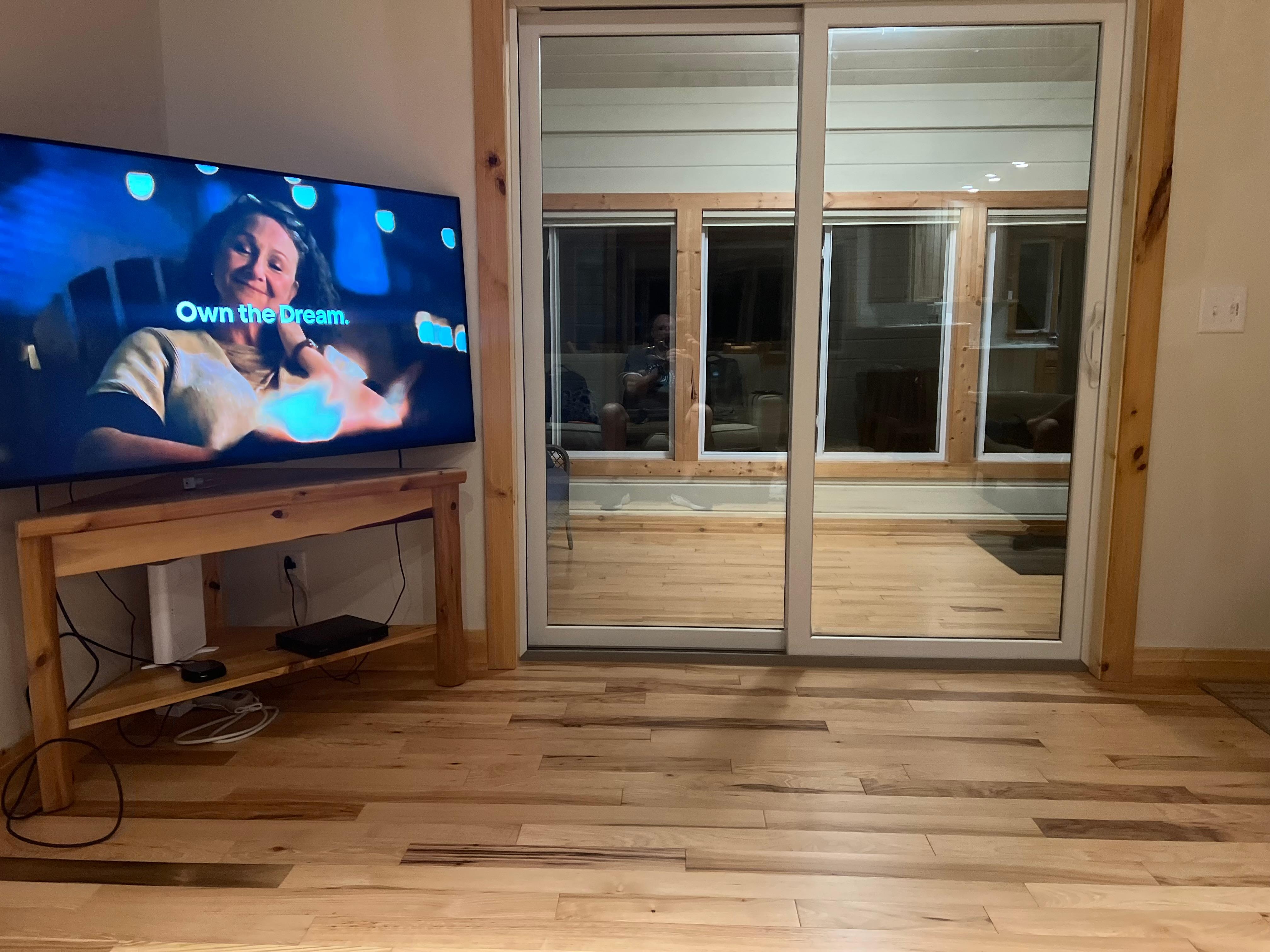 Living area w/ slider to 3 season room.