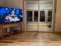 Living area w/ slider to 3 season room.