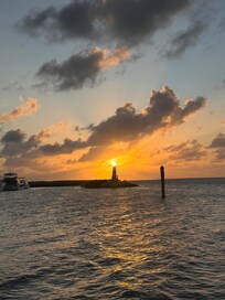 Sunset lined up perfectly with the lighthouse statue!