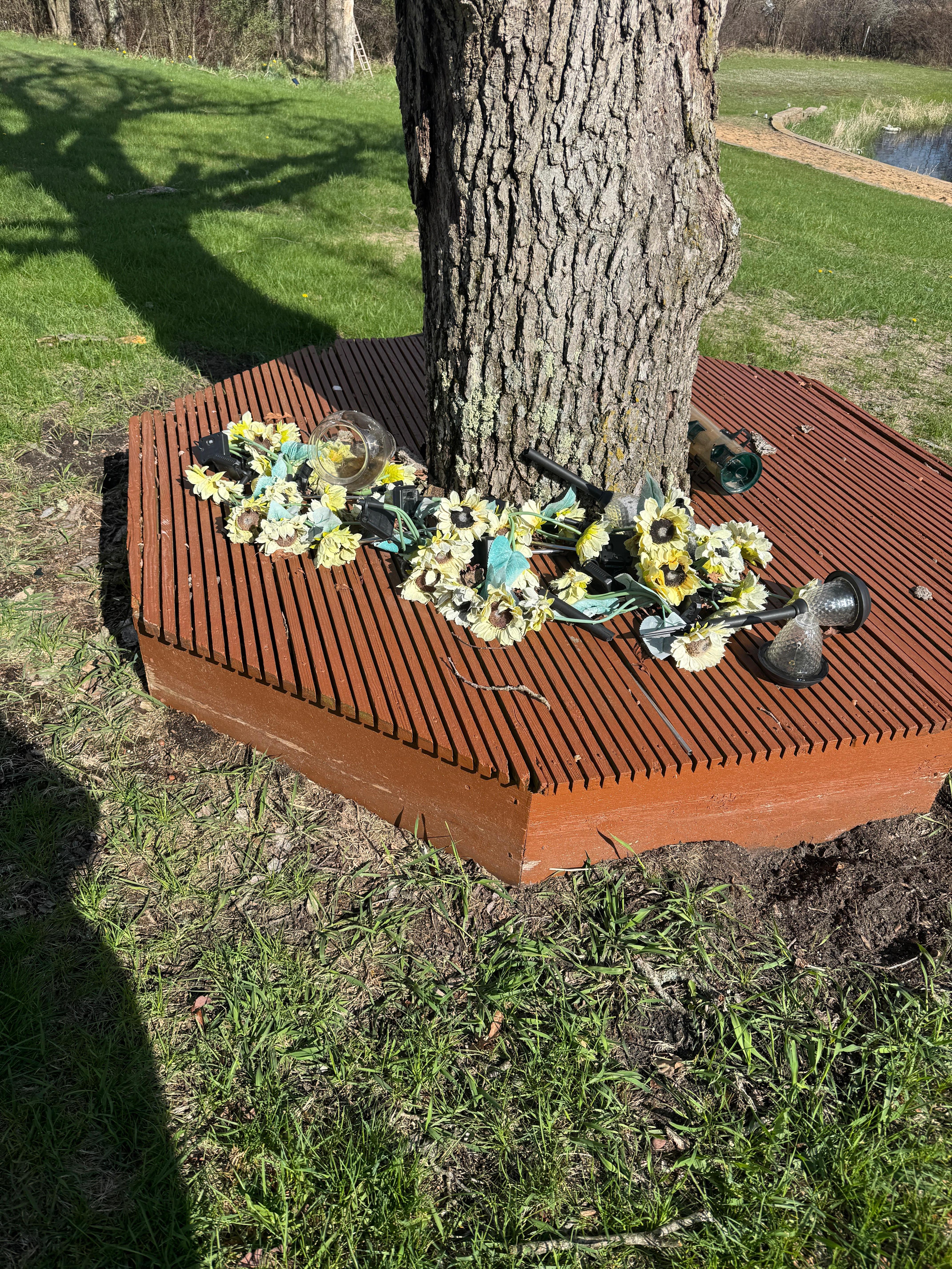 Broken solar lights, flowers, vases
