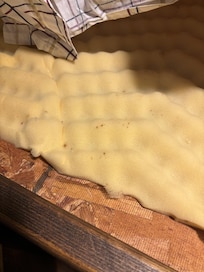 The dark or black dots and coloring left on mattress- likely bed bug excrement. These spots are a common sign of a bed bug infestation, along with other signs like blood stains and molted skins.