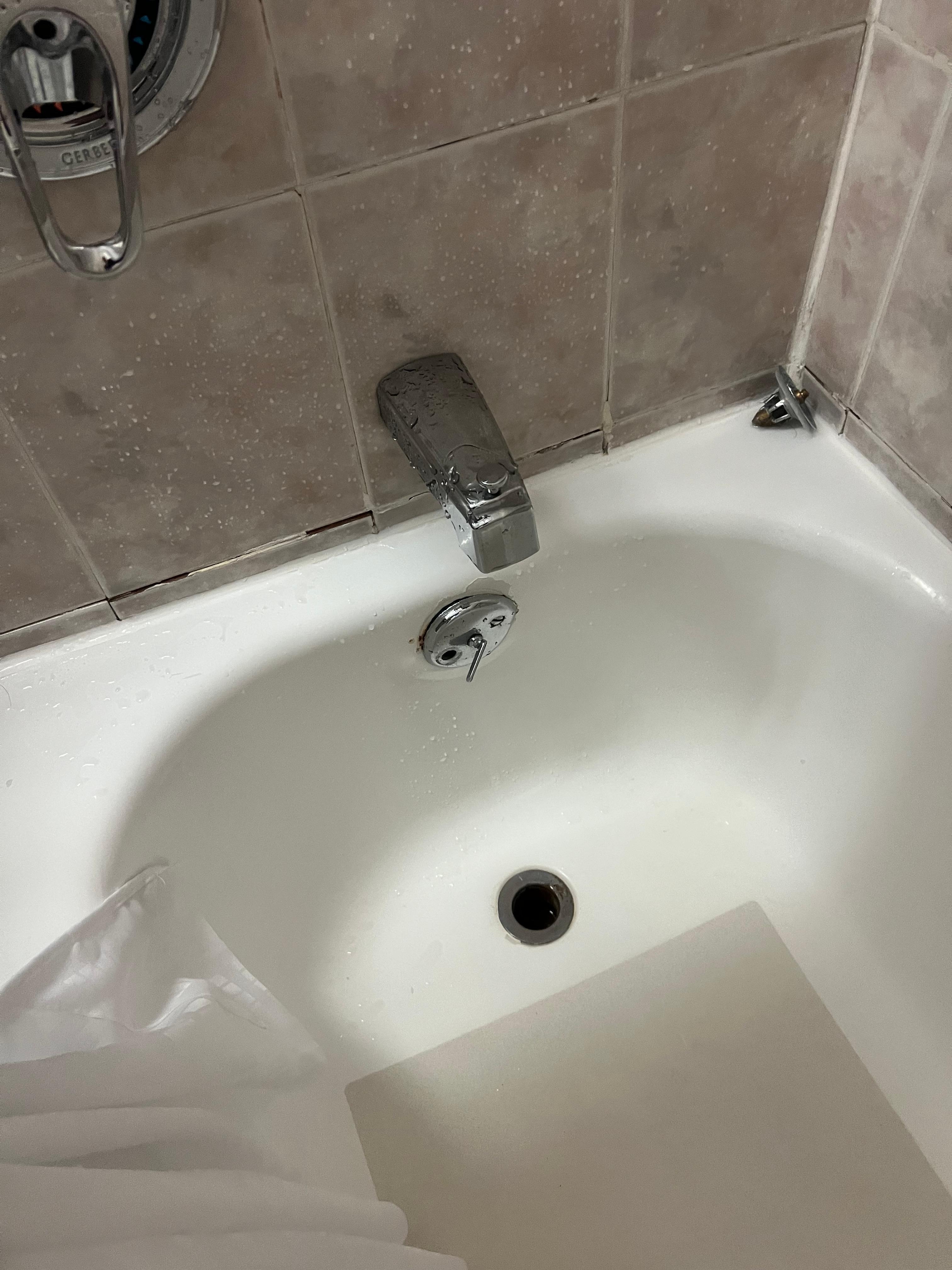 Cracked tiles in tub/shower area.
Tub didn’t drain well