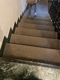 Dirty old carpet in some areas.