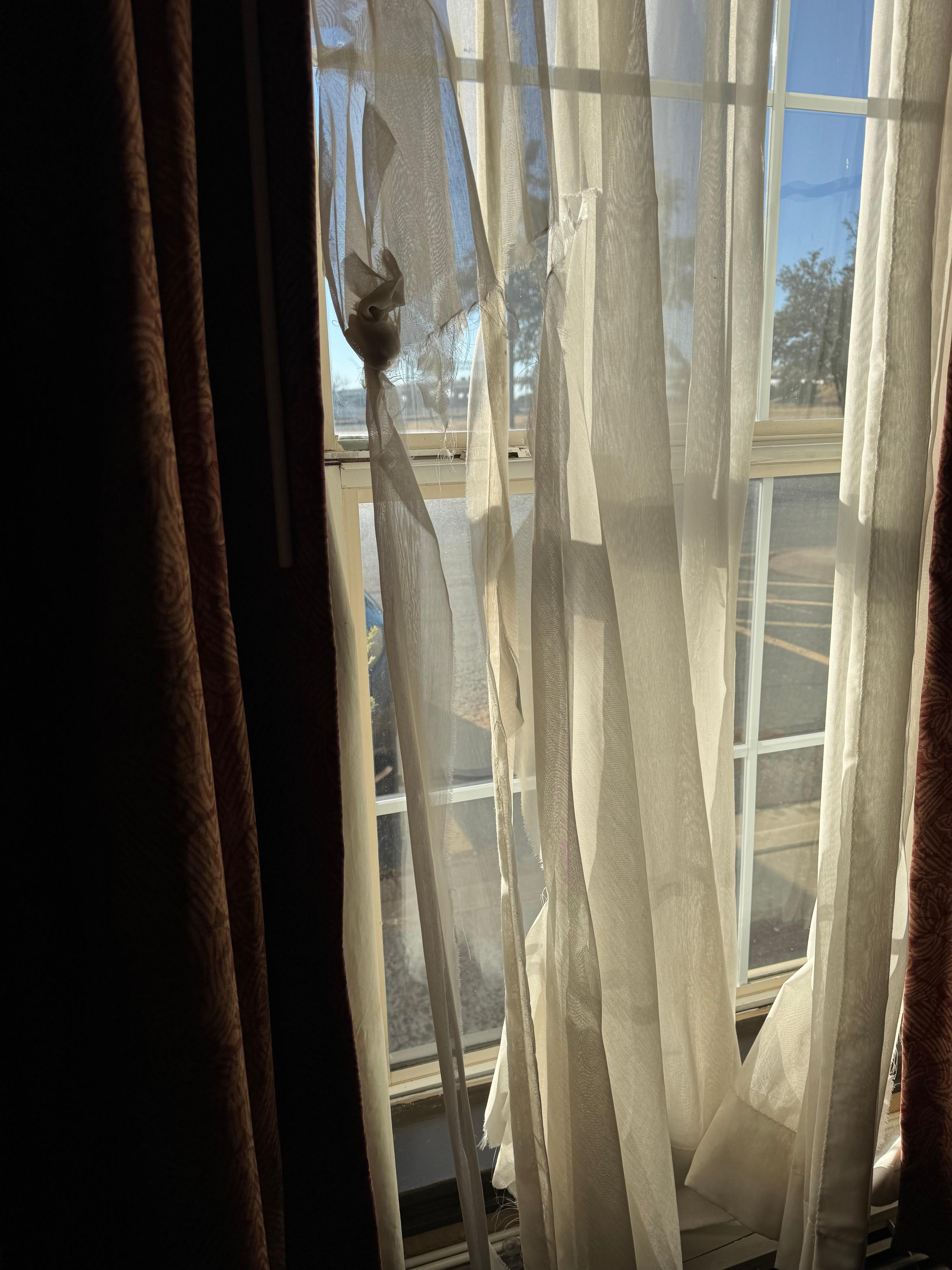 Torn curtains in RM 114