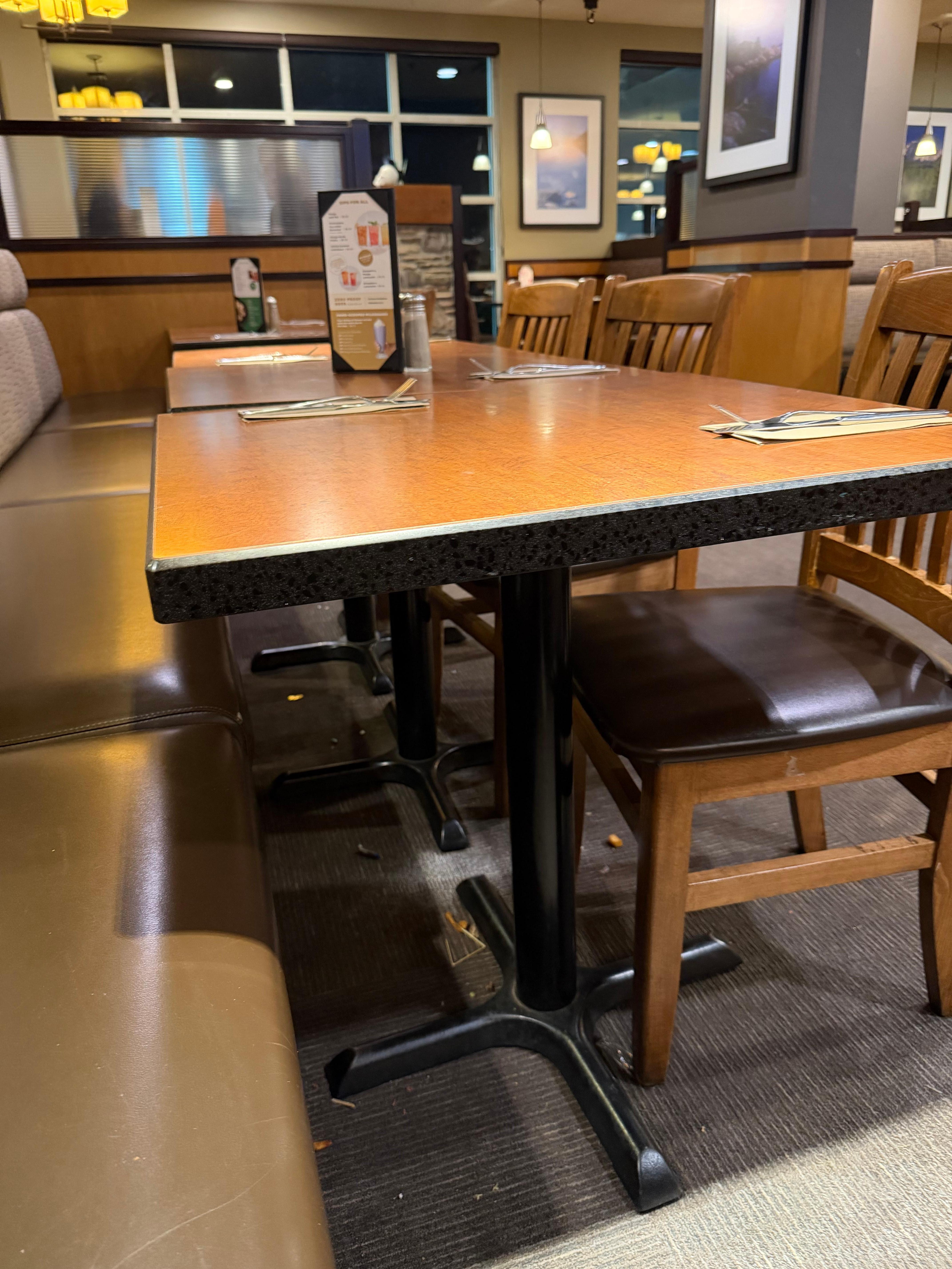 Food and trash under all of the tables. 