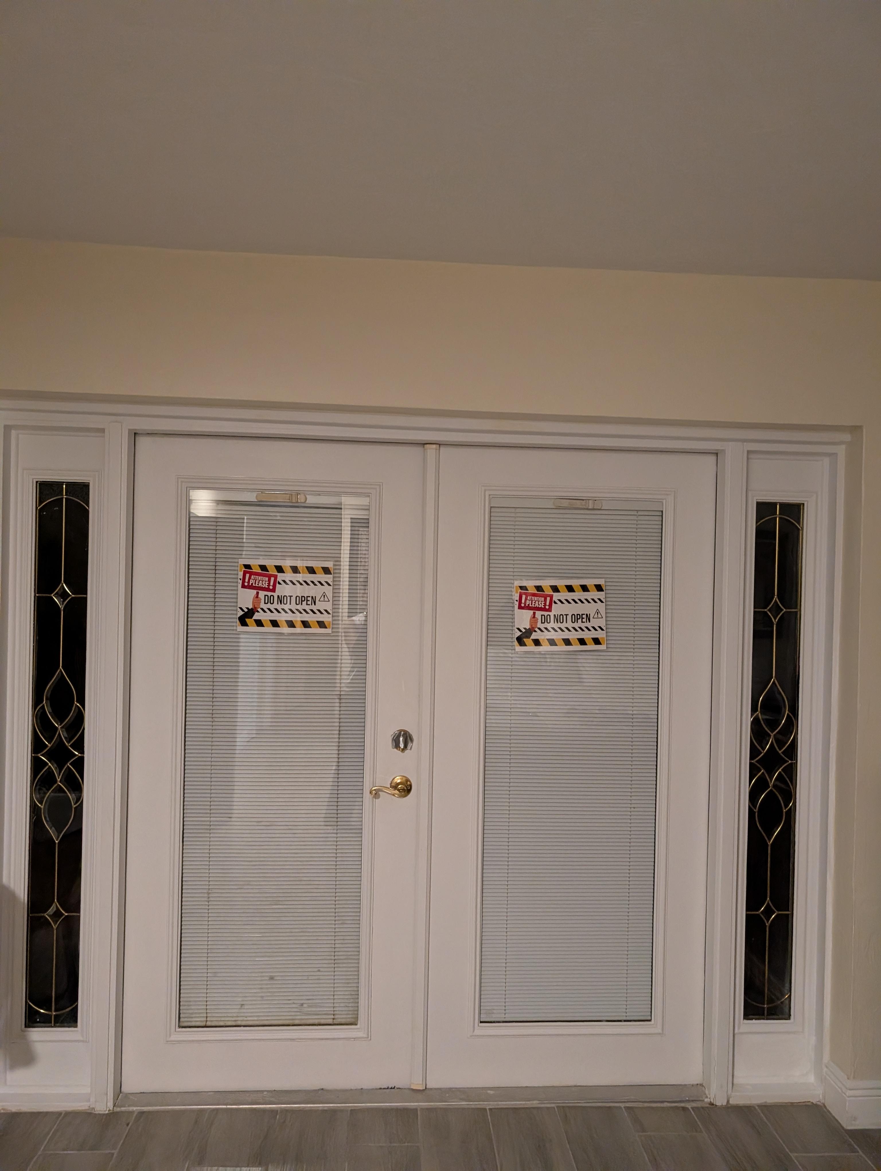 Master bed French doors w caution tape!