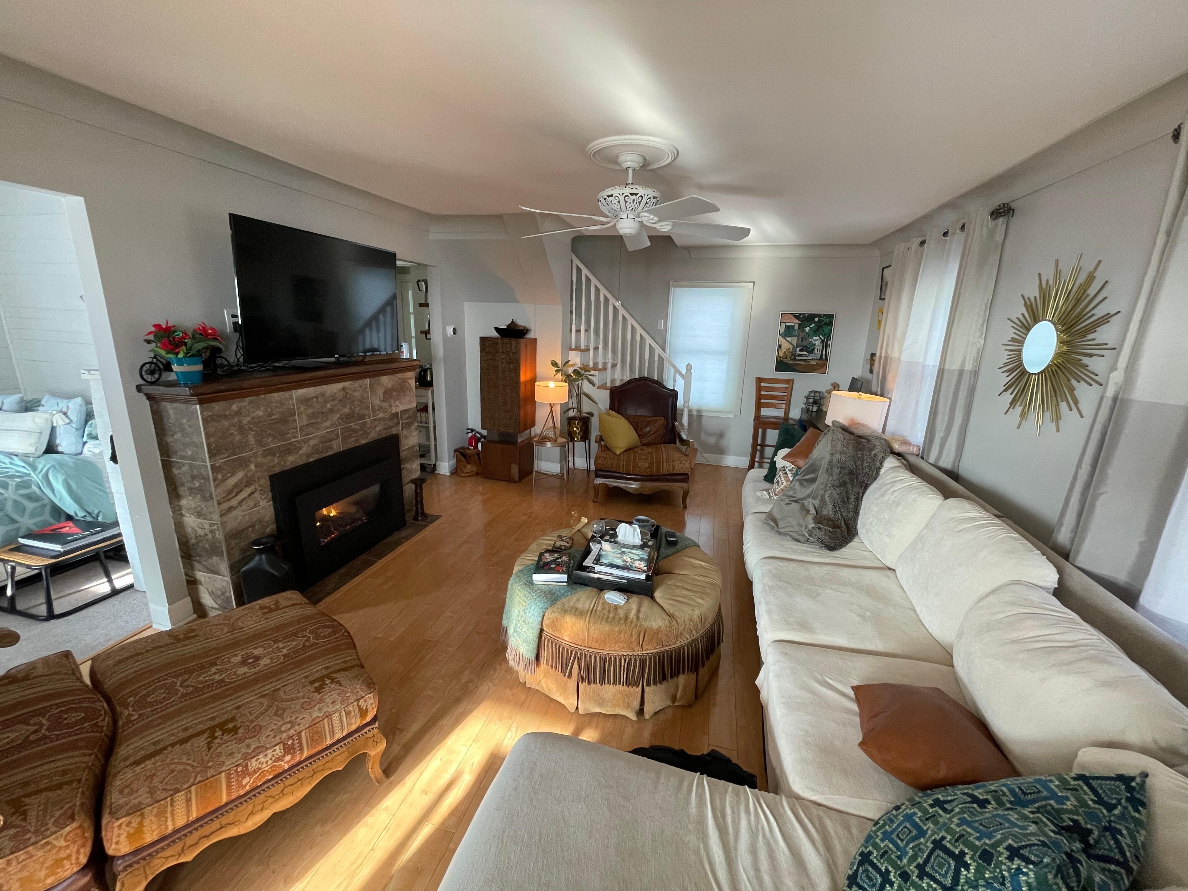 Gorgeous fireplace and comfy sectional.