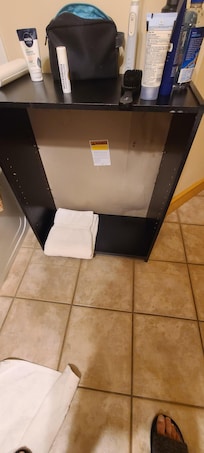 Old bookshelf, minus shelves for towels storage.