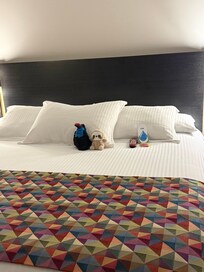 They even made our bed all cute with some plushies we had on the table.