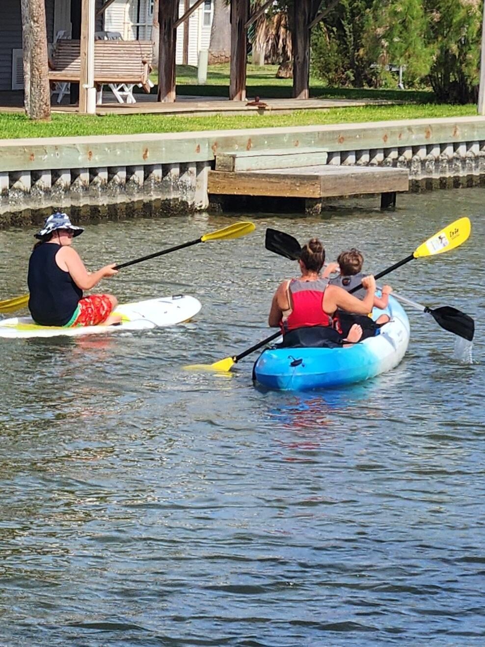 Kids kayaking and paddle board