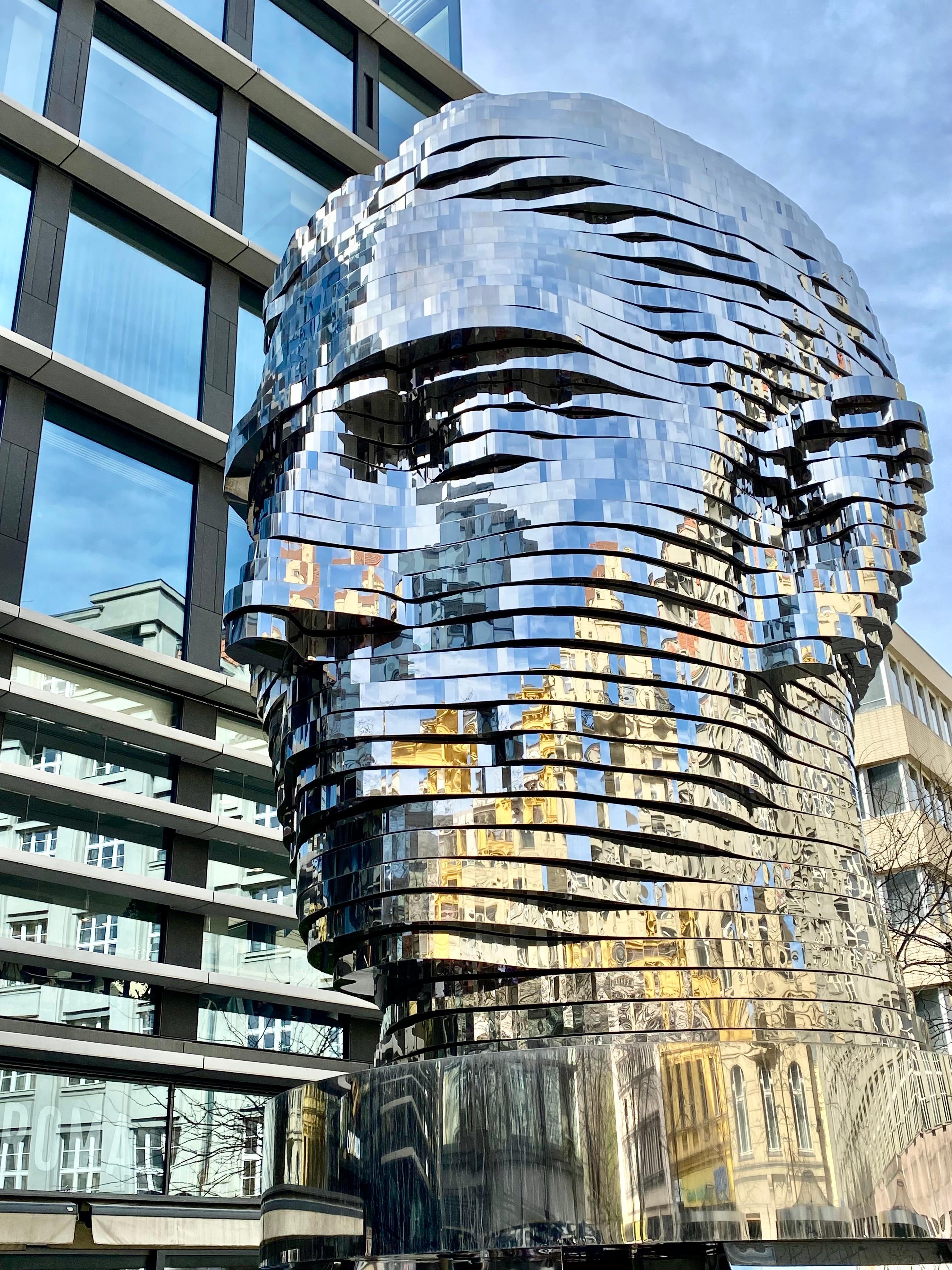 The Head of Franz Kafka, also known as the Statue of Kafka, is an outdoor kinetic sculpture by David Černý depicting Bohemian German-language writer Franz Kafka, installed on 31. October 2014 .
