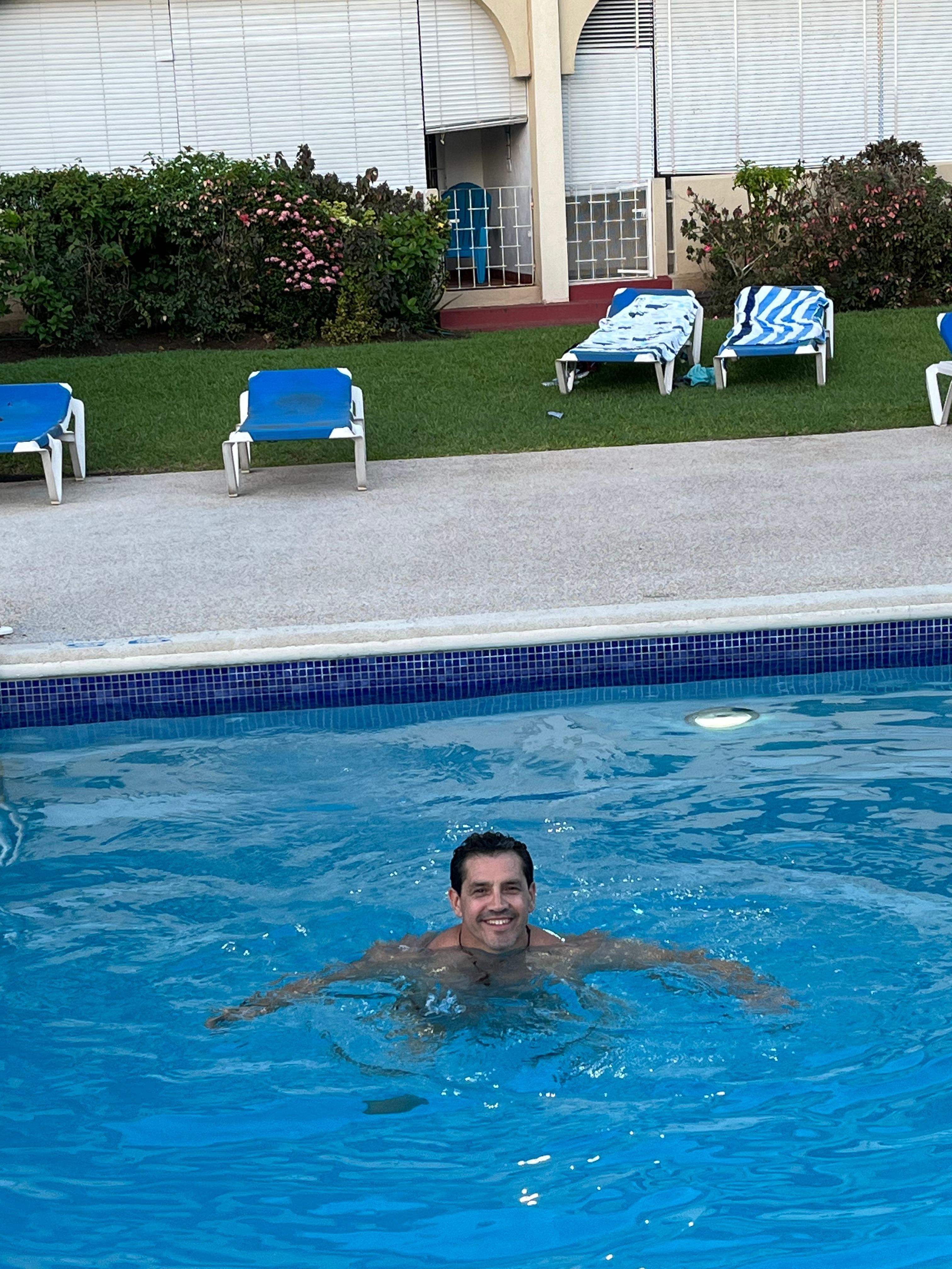 Condo walks right out to pool - pictured in background (left side)
