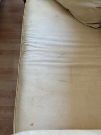 stained sofa and loveseat