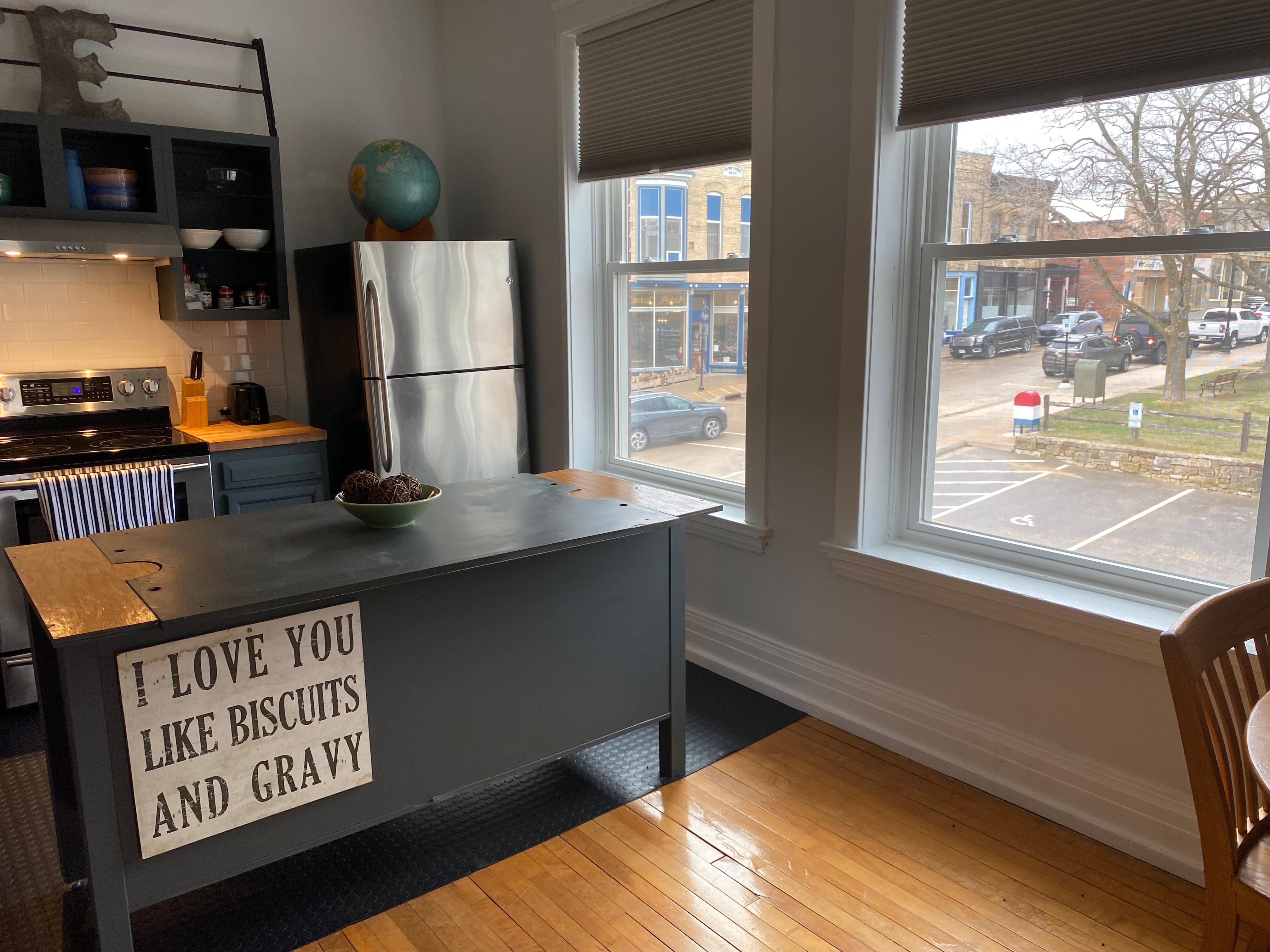Love this sunny kitchen that looks out on galleries and downtown. 