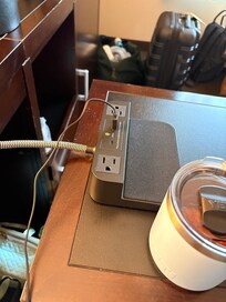 We had to bring the nightstand over to plug in the curling iron.