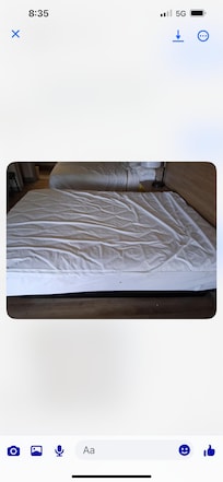 Bed is full of crumbs sheets dirty no covers