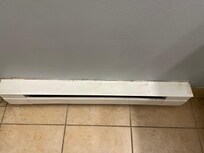 Bathroom baseboard heat had dust and hair all over it