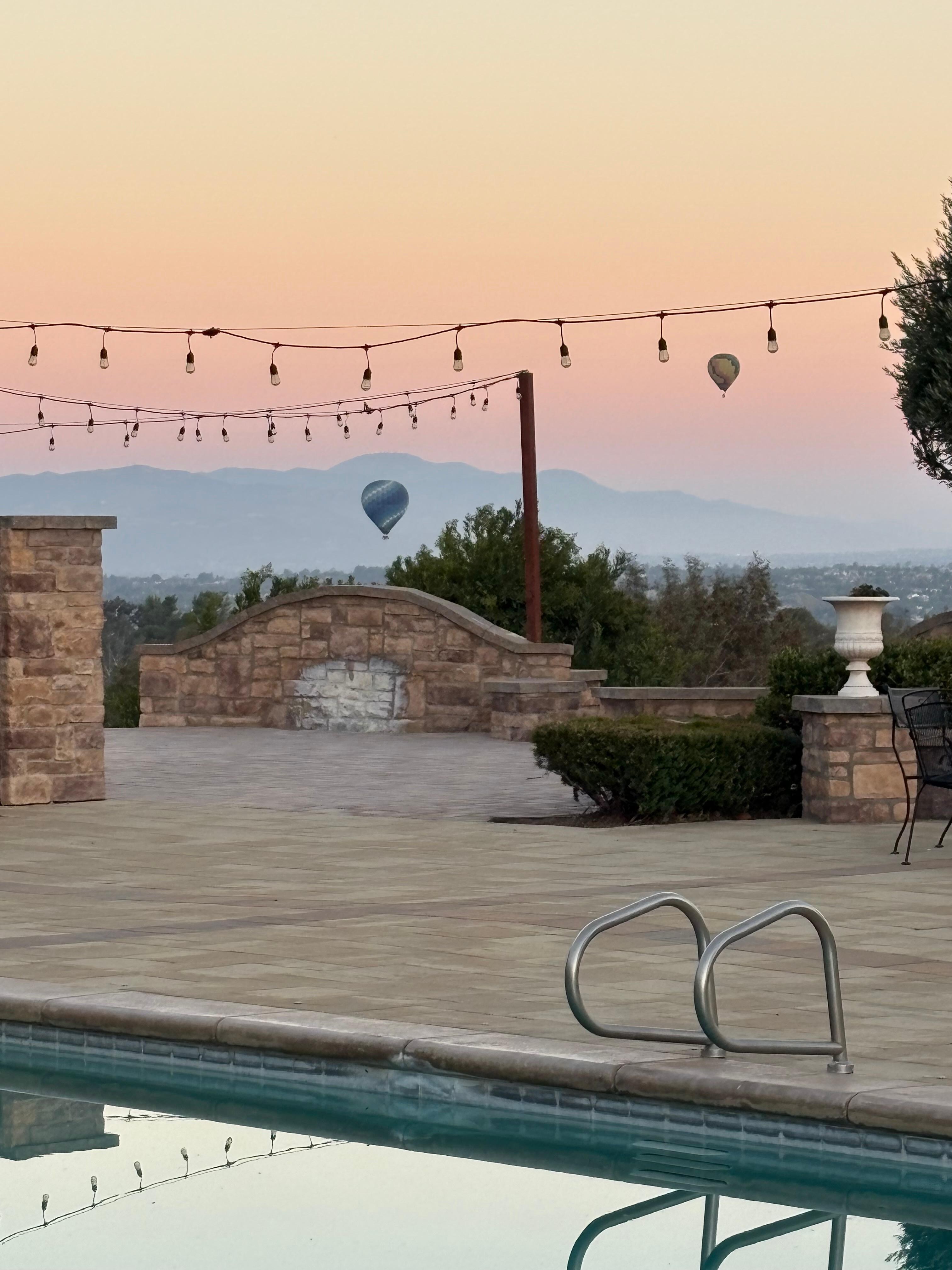  Backyard pool area. With balloons flying in the background 