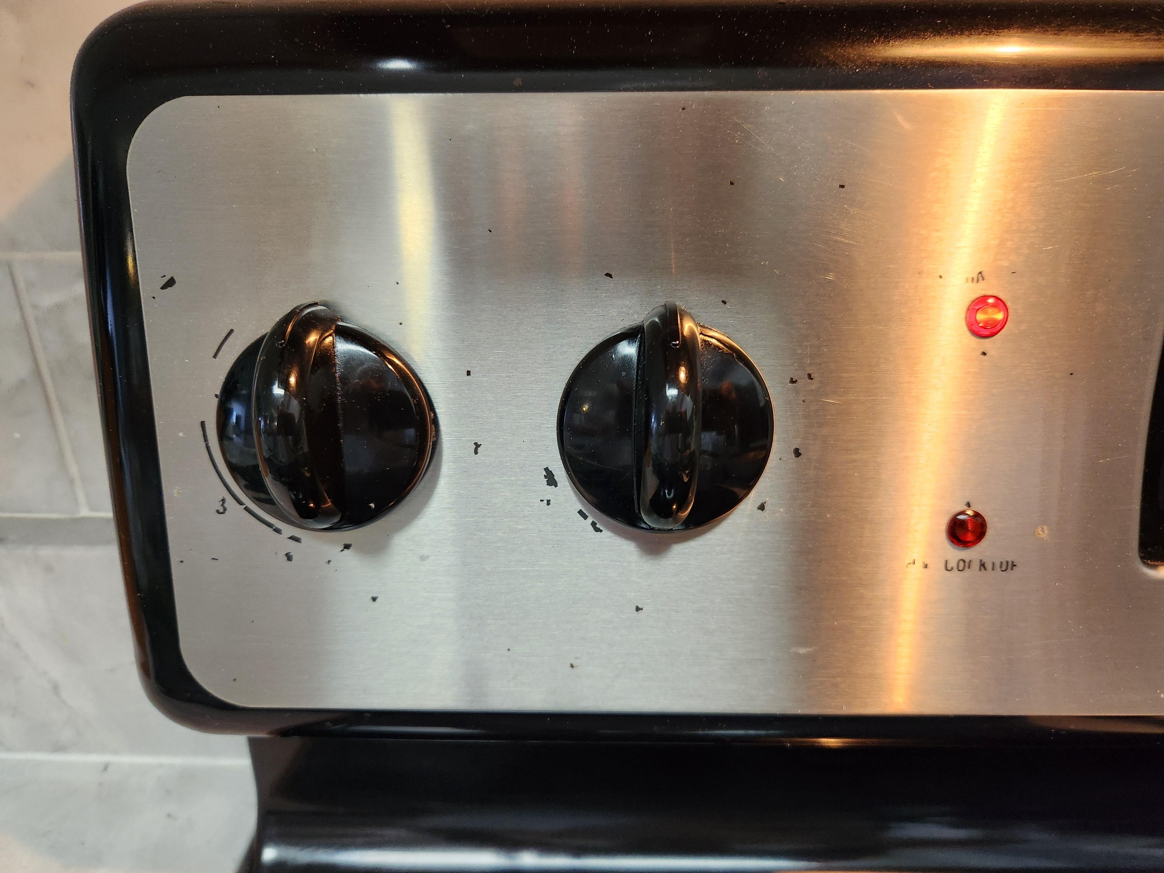 Knobs on the left side of the stove