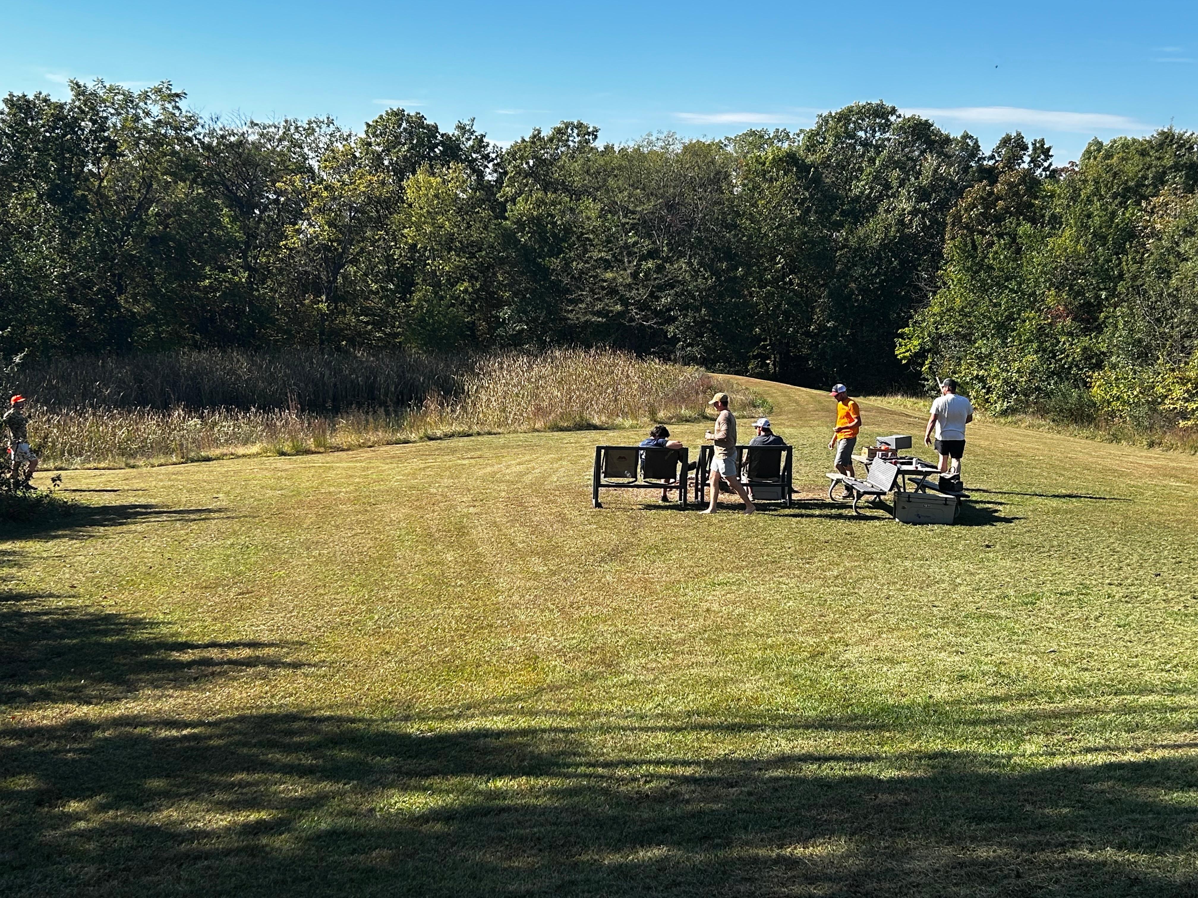 Enjoying the picnic table by the fire pit in the afternoon getting prepared for the BBQ and fire.