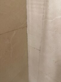 Brown grout around tub