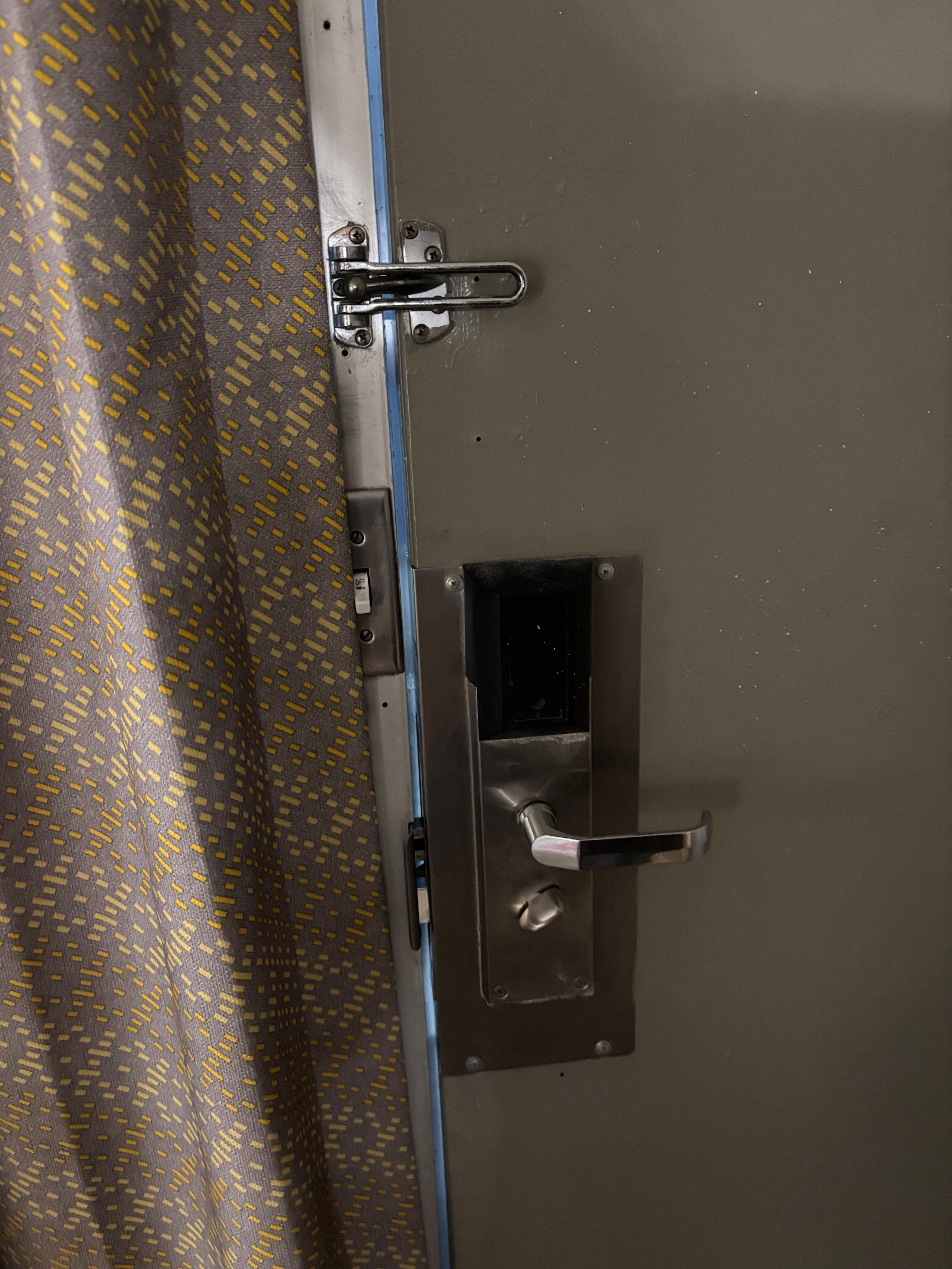 211 exterior door did not close all the way, a major safety issue