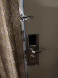 211 exterior door did not close all the way, a major safety issue