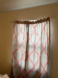 Broken curtain rod in front bedroom.