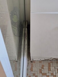 severe mold between bathroom cupboard and shower