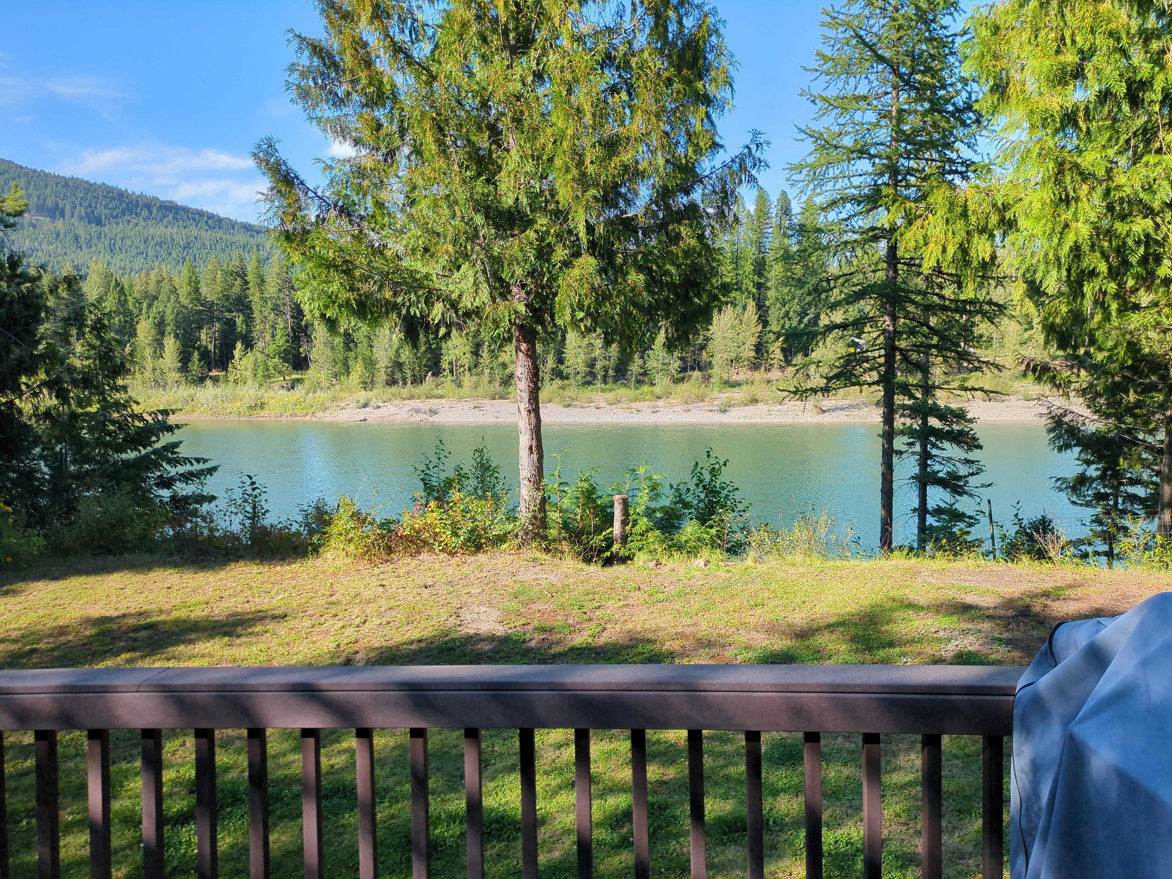 Amazing view from the back deck where we are our meals! No access to river from the house, the slope is way to steep. 