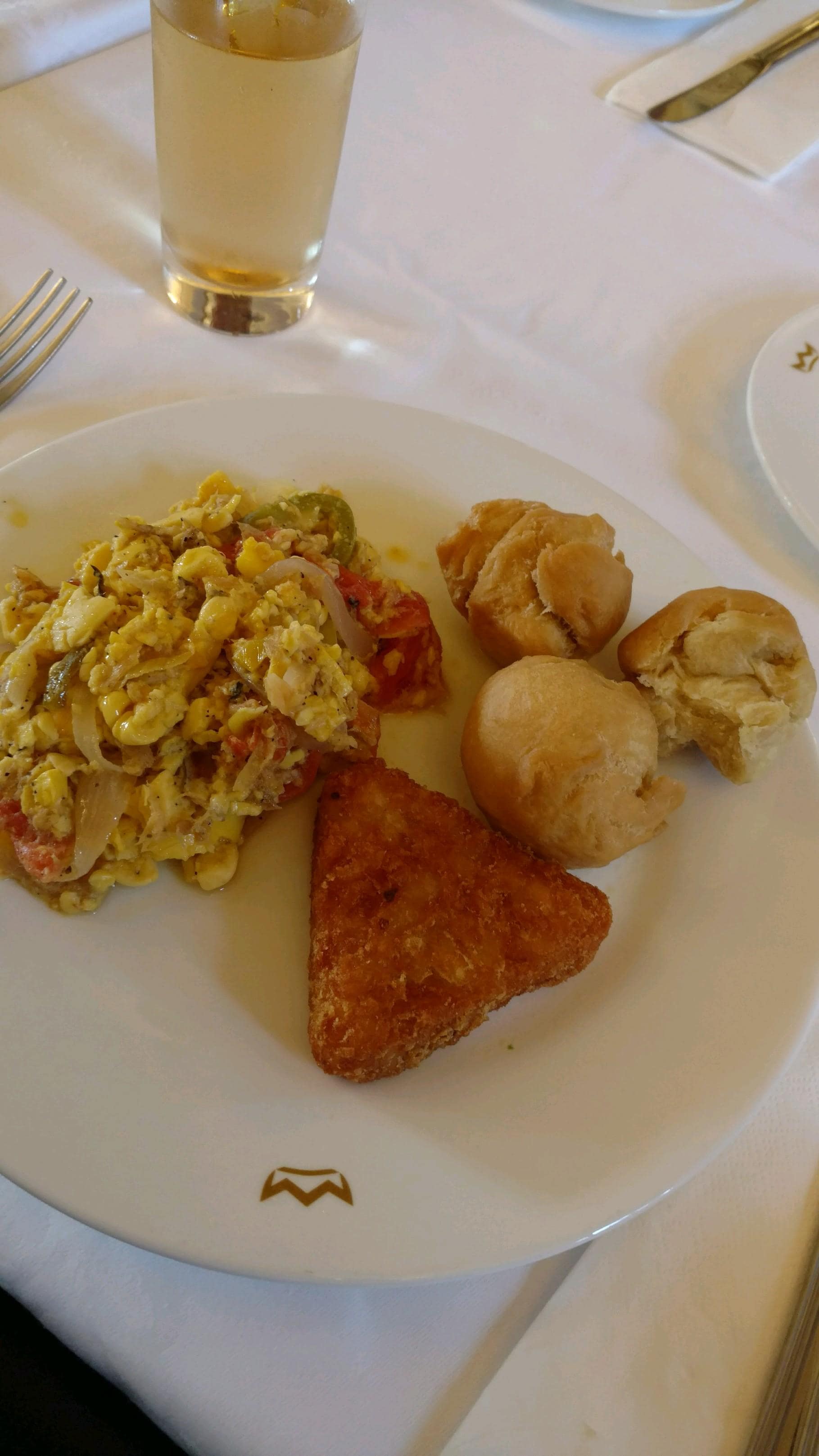 Ackee and salt fish breakfast with fried dumplings and a hashbrown