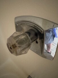 Next to the bed, exposed.