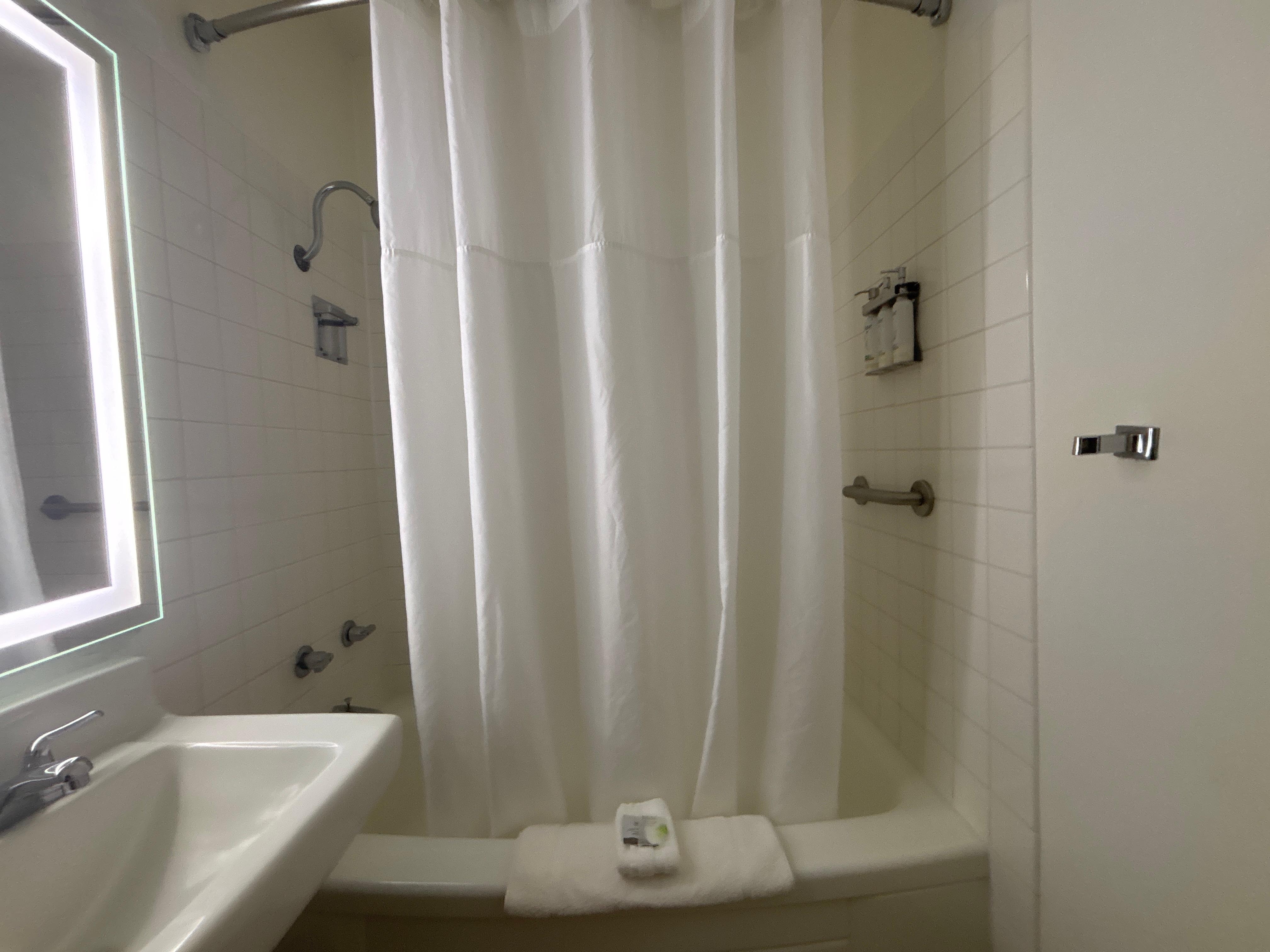 Large shower in a big bathroom area. 