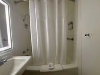 Large shower in a big bathroom area.