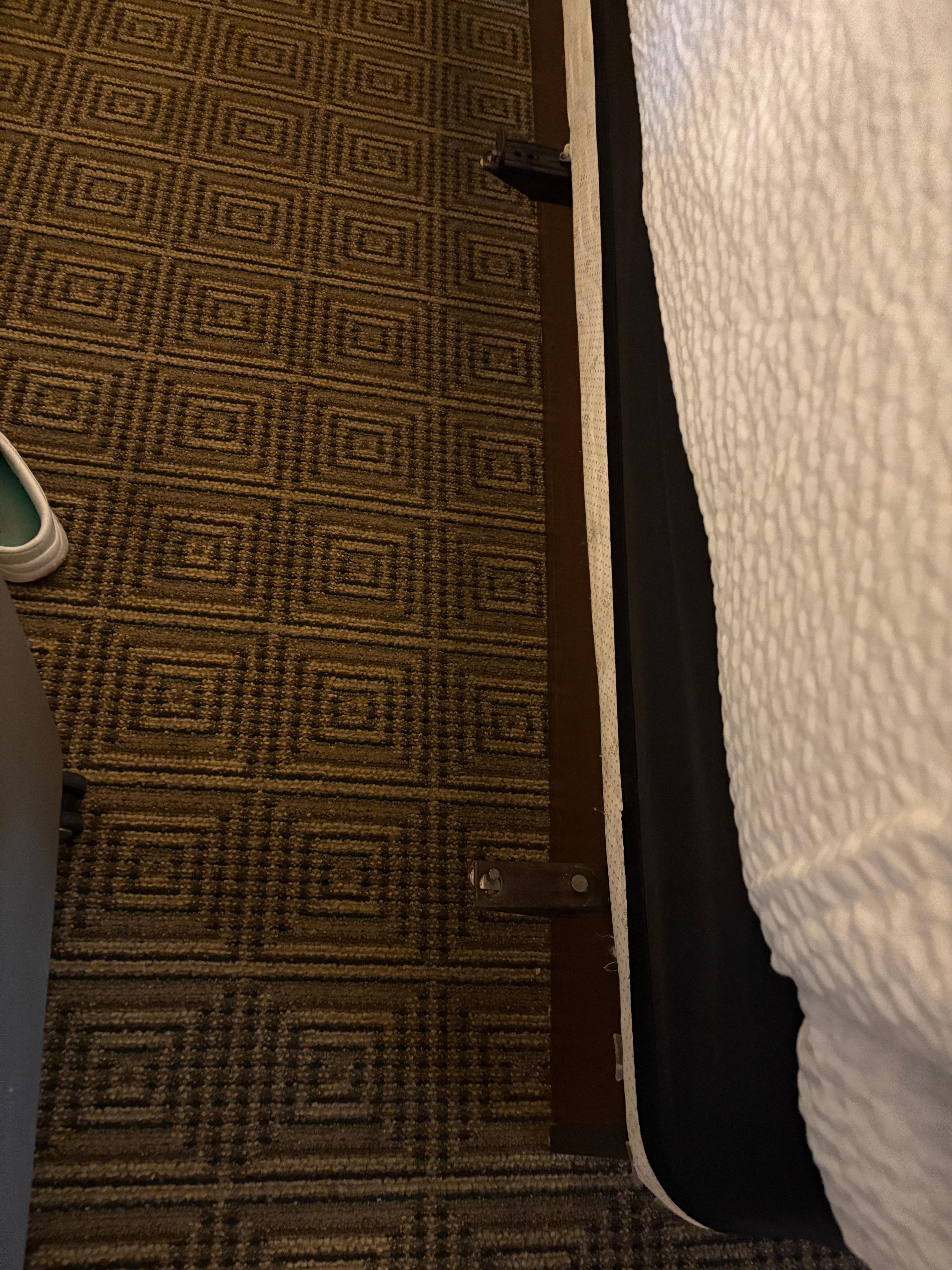 Large metal strips sticking 3 inches out from box spring