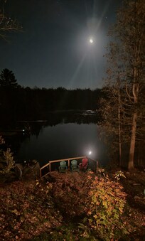 Moon over water in the fall.