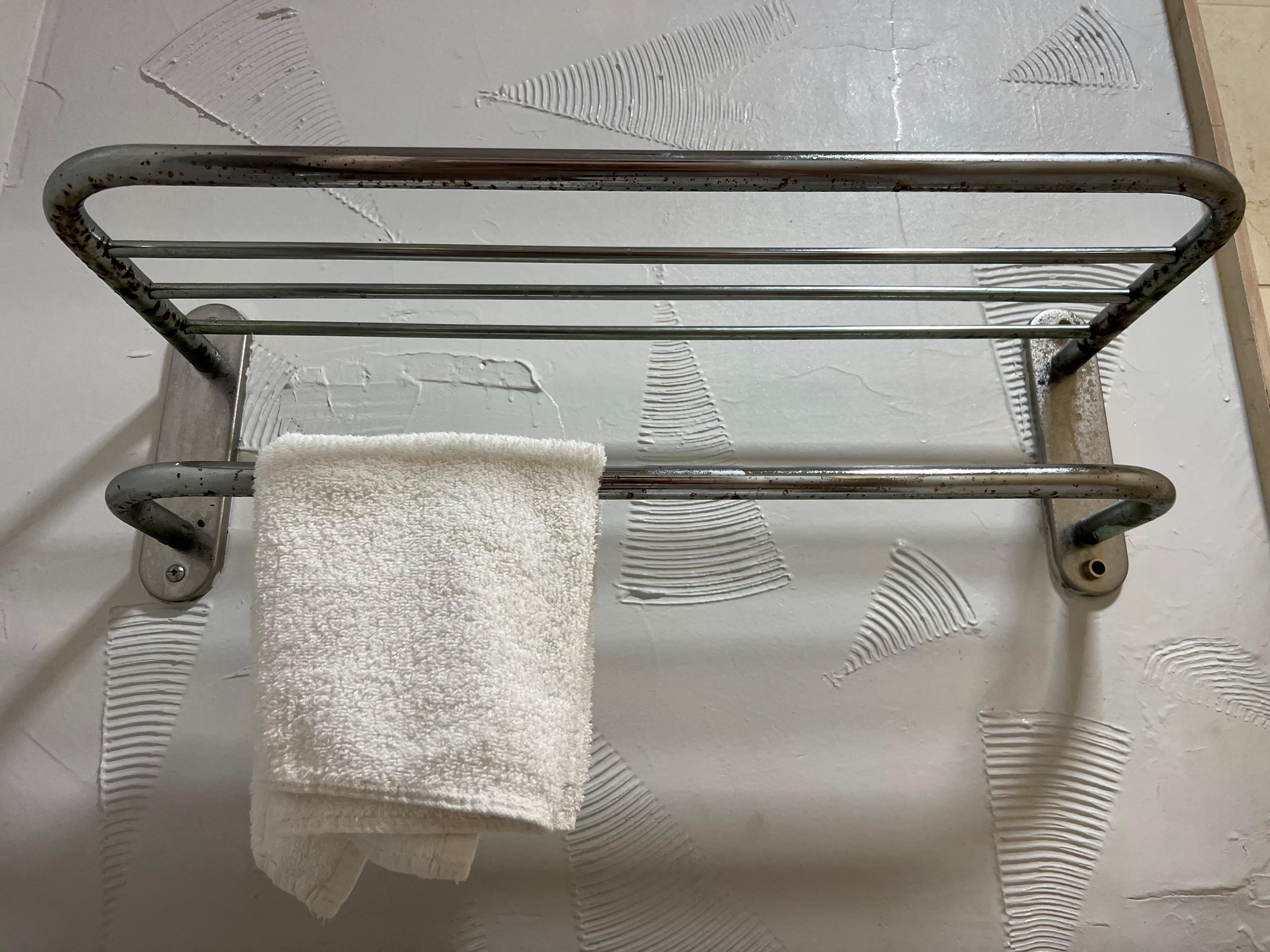 Rust covered towel rack