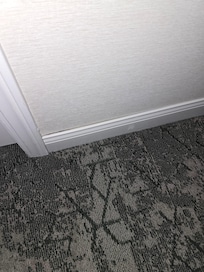 Loose or damaged base board.