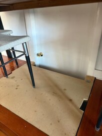 Trap door and door on wall by dining table