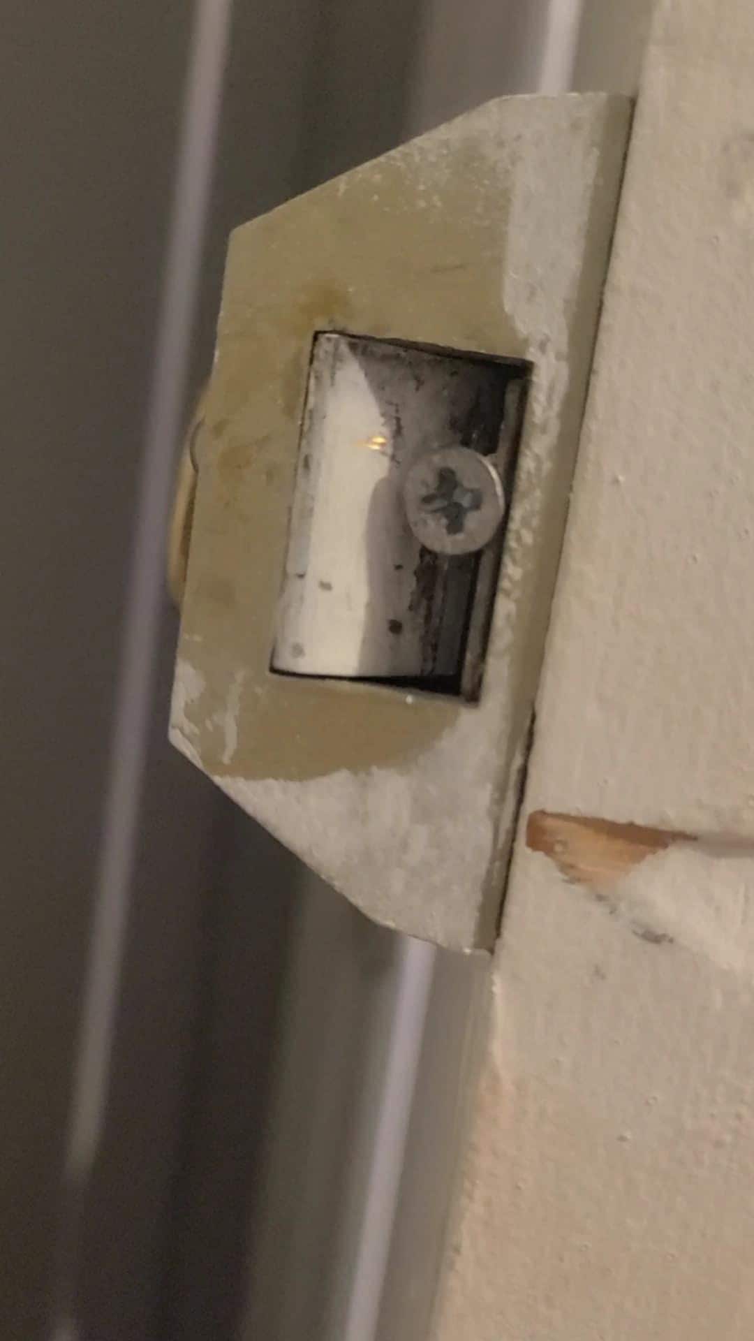 Screws shoved in door hinges. Unable to lock our room.