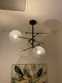Dirty light fixture without light bulbs replaced
