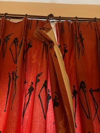 Torn curtains in bedroom
