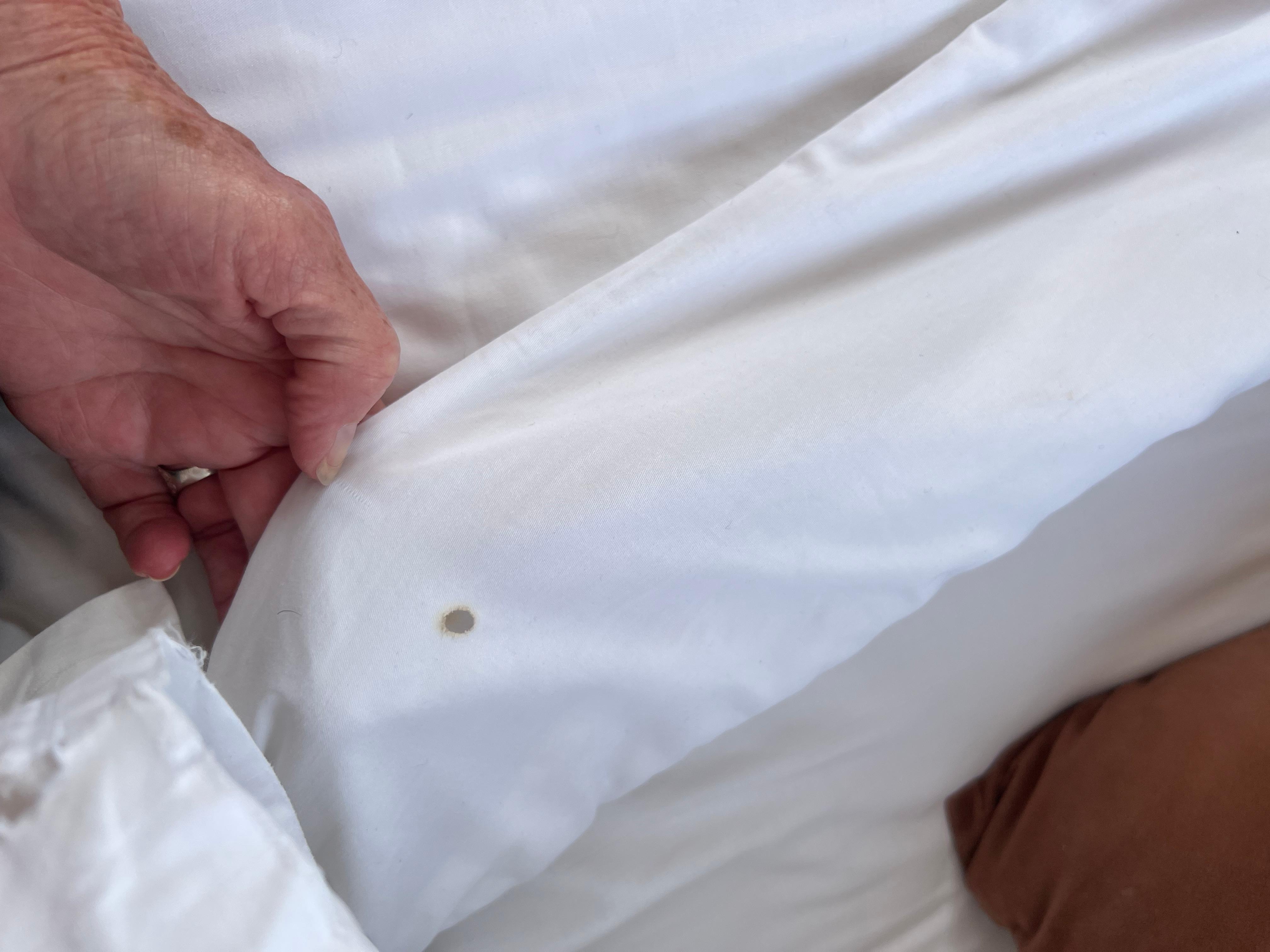 Cigarette burns on comforter,