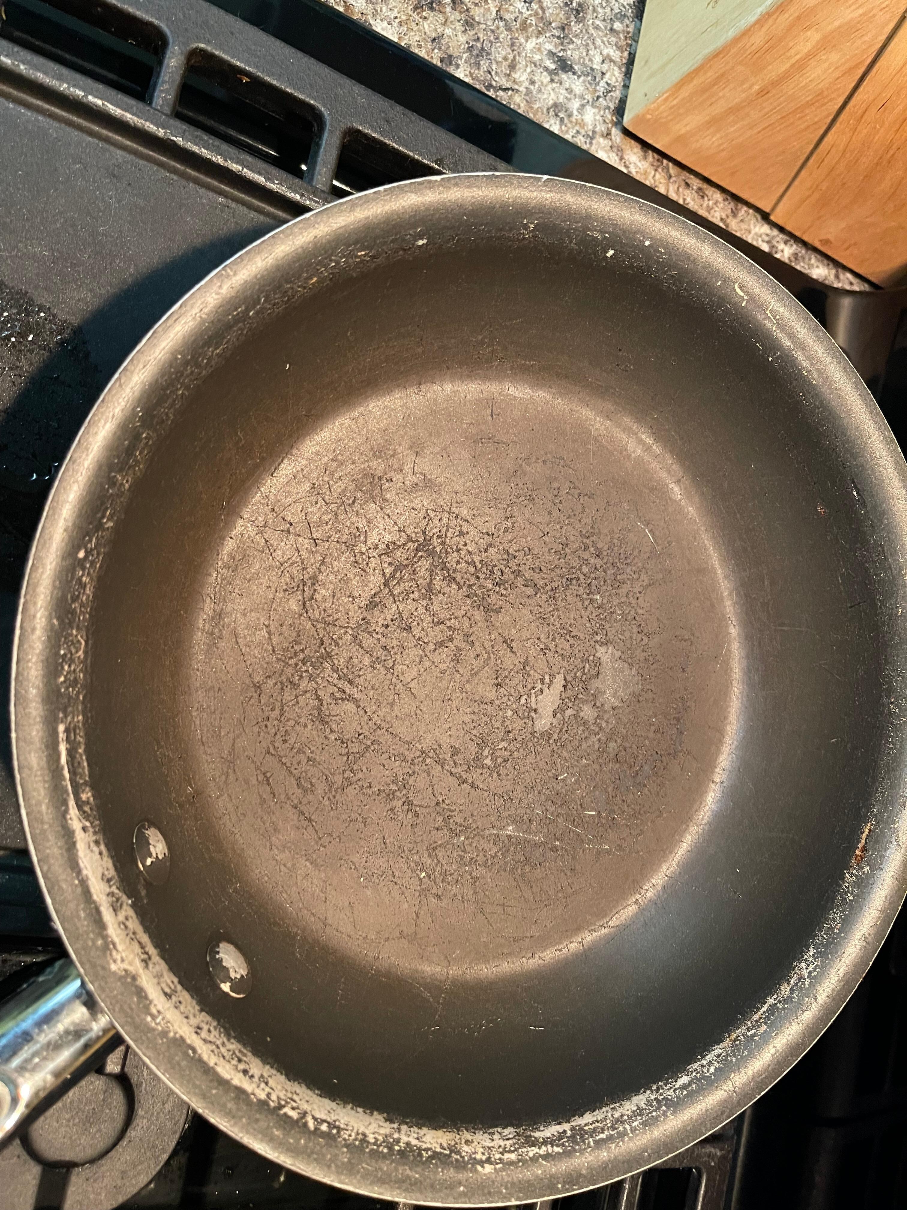 Frying pan. Gouged and scratched. 
(Enlarge for view)