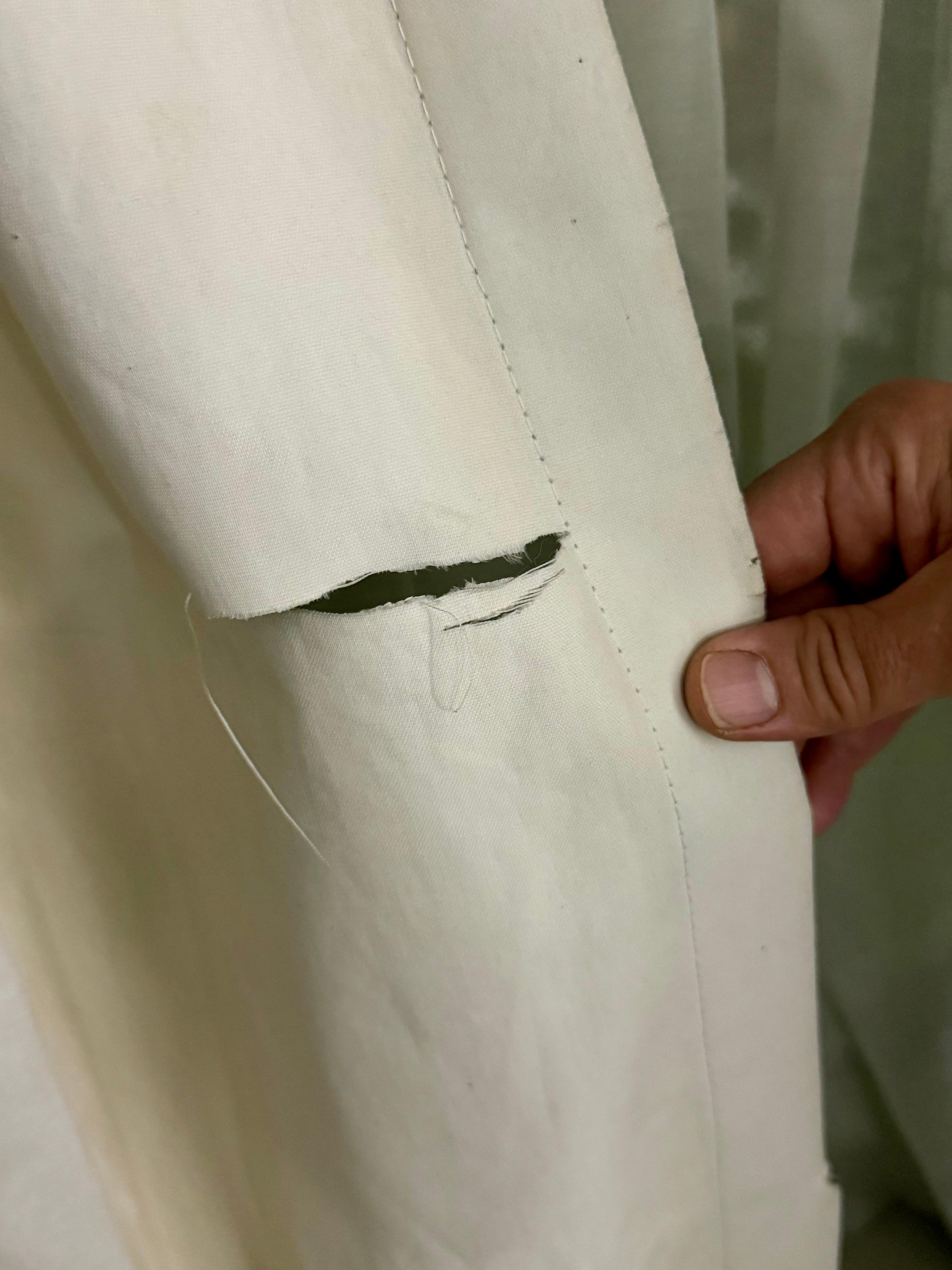 Tears in dirty curtains 