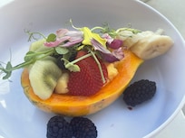 Delicious local papaya fruit bowl from rooftop poolside restaurant