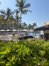 Side of adult pool where access to buffet is and also to the beach