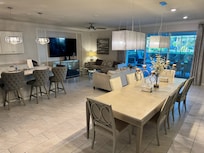 Beautifully decorated family room looking out toward pool