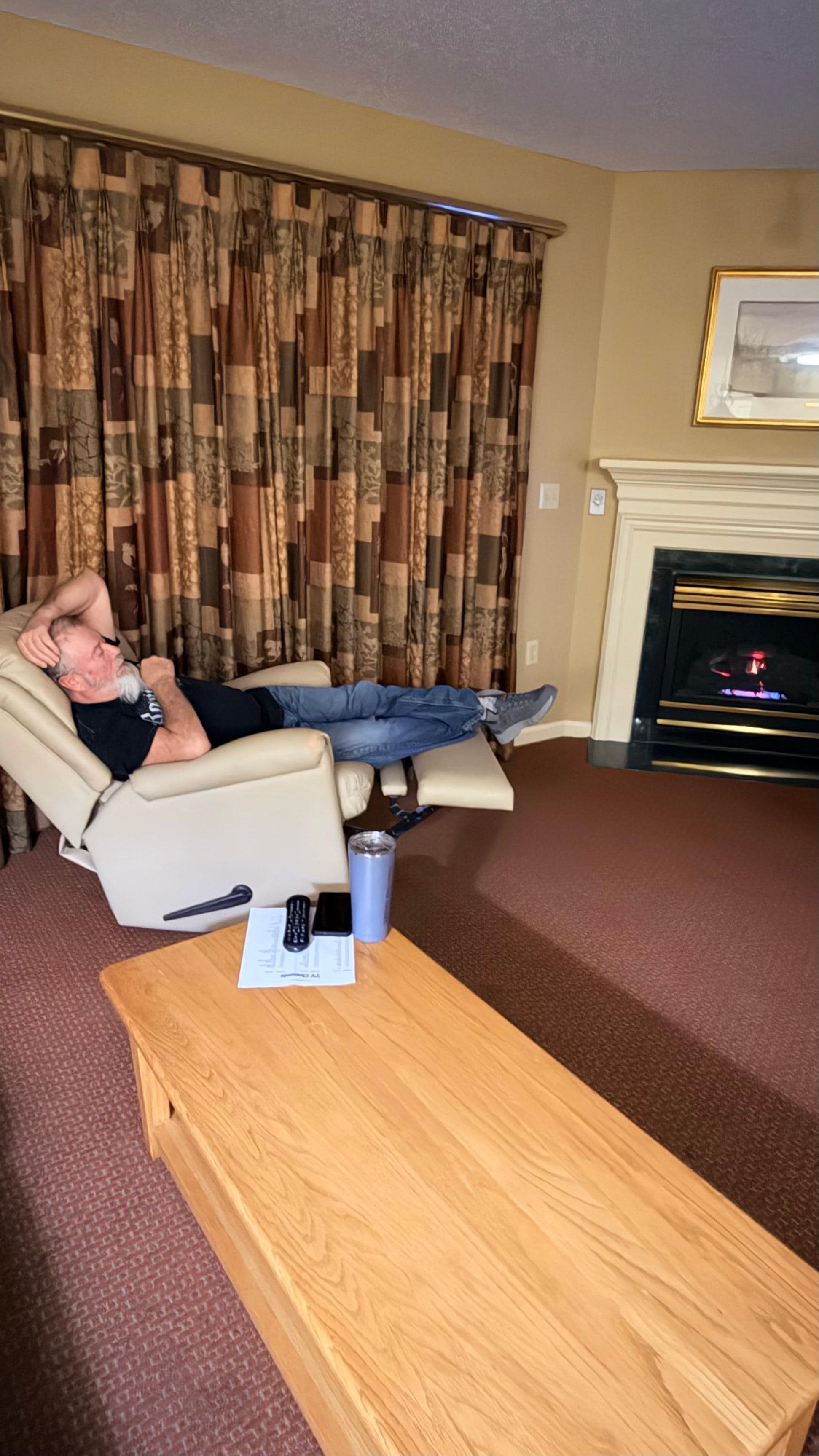 Husband enjoying fireplace and recliner 